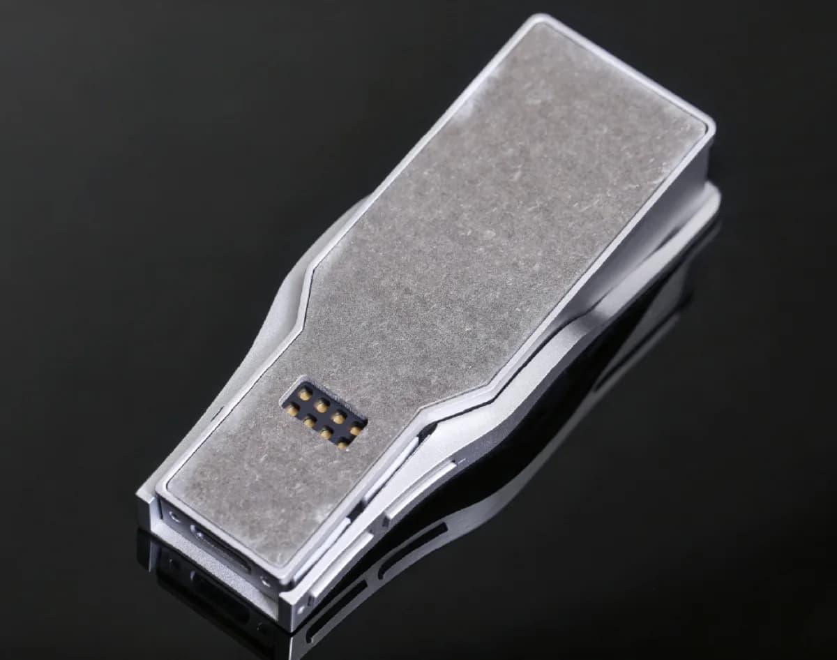 Close view of the silver OPERA faceplate and its machined surface